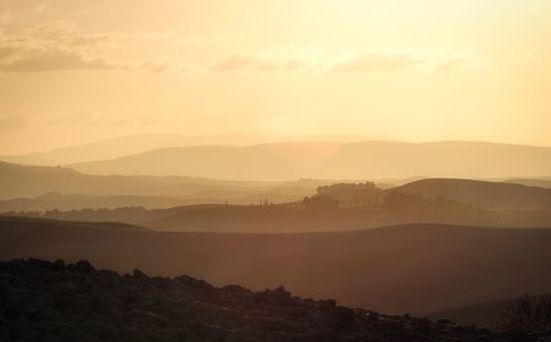 Scenic view of mountains against sky during sunset
