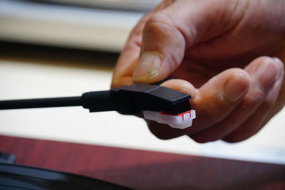 Close-up of person holding mobile phone