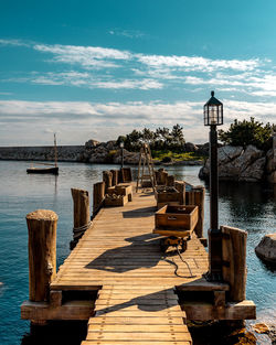 Pier over sea against sky