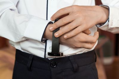 Close-up of man holding hands