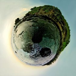 Close-up of sea shore against sky