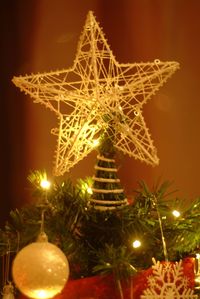 Low angle view of illuminated christmas tree at night