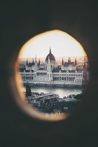 Buildings in city at sunset