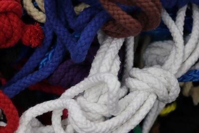 Close-up of ropes tied up on rope