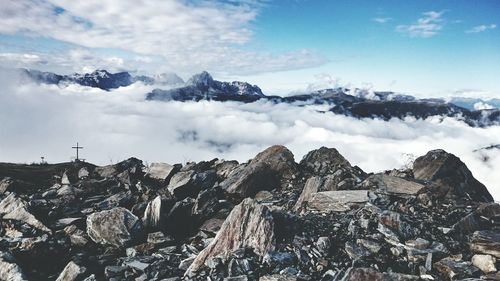 Scenic view of mountains against cloudy sky