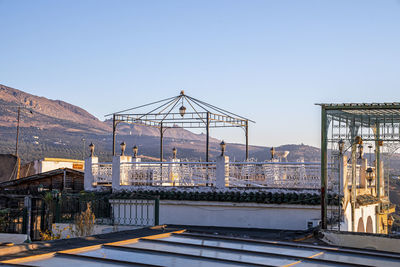 Open air rooftop restaurant and mountain landscape against sky