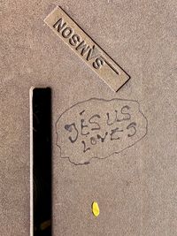 High angle view of text on sand at beach