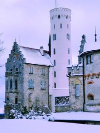 Historic building against sky during winter