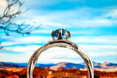 Close-up of ring against sky