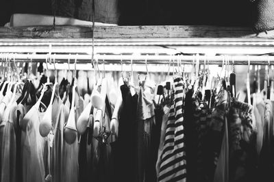 Close-up of clothes hanging in store