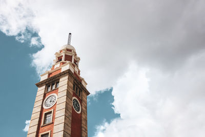 Low angle view of clock tower against sky