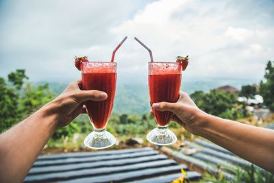 People toasting with drinks