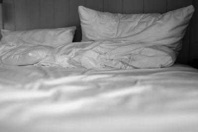 Midsection of blanket on bed at home