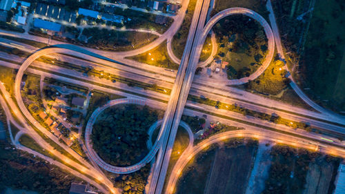 Aerial view of illuminated highways at night