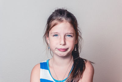 Portrait of girl against white background