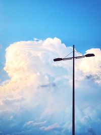 Low angle view of windmill against sky