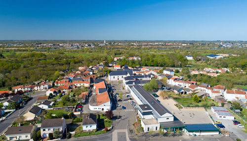 High angle view of buildings in city against clear sky