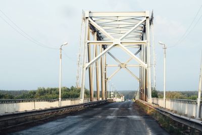 Bridge over road against sky