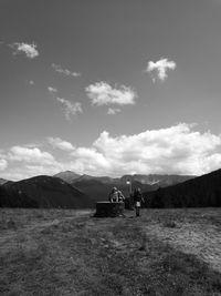 Scenic view of mountains against cloudy sky