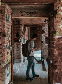 Full length of man standing in abandoned building