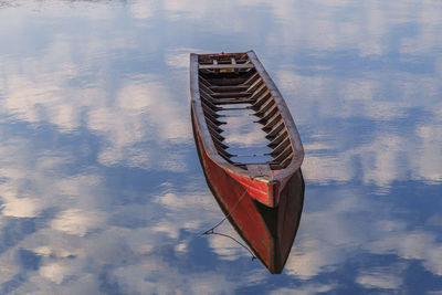 High angle view of red boat moored on water