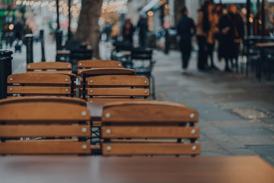 Empty outdoor cafe tables on a sidewalk in london, uk, selective focus.