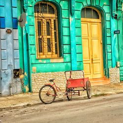 Bicycles on street against building