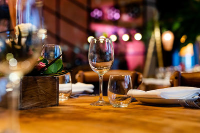 Luxury table settings for fine dining with and glassware, beautiful blurred background. 