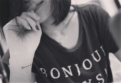 Close-up of woman with text