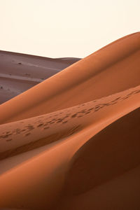 Scenic view of desert against clear sky