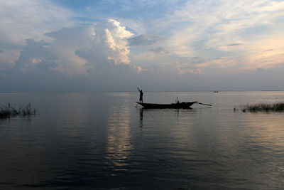Silhouette of boats in calm sea