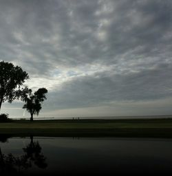 Scenic view of landscape against cloudy sky