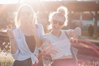 Panoramic shot of woman with arms raised