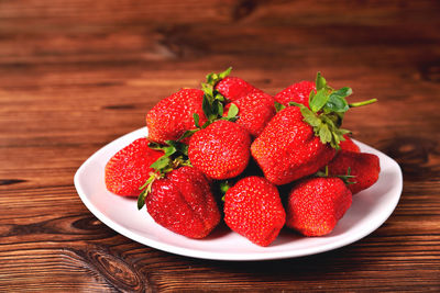 High angle view of strawberries in bowl on table