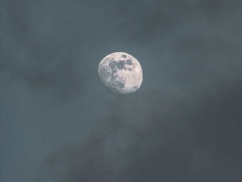 Low angle view of moon against sky at night