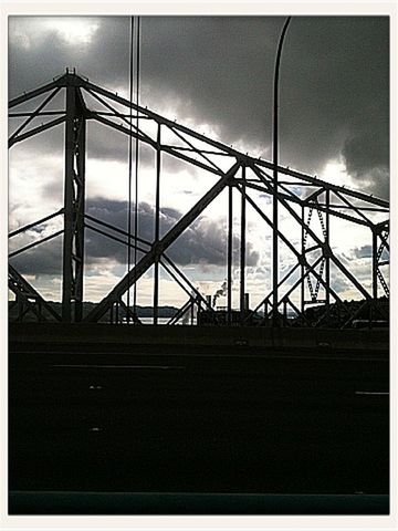 transfer print, built structure, architecture, sky, low angle view, auto post production filter, cloud - sky, connection, bridge - man made structure, cloud, cloudy, engineering, railing, building exterior, transportation, metal, day, silhouette, no people, outdoors