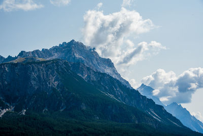 The peaks of the dolomites covered by clouds around the town of cortina d'ampezzo, belluno, italy