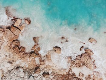 Aerial view of rock formation at beach