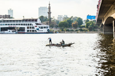 People in boat at harbor