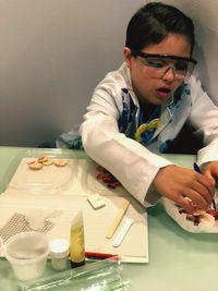 Boy doing science experiment with food