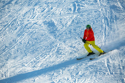 Man skiing on snow covered mountain