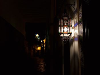 Illuminated tunnel at night