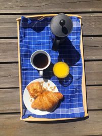 High angle view of breakfast served on wooden floor