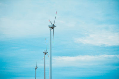 Low angle view of windmill against sky