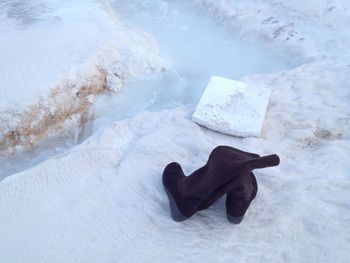 High angle view of shoes on snow covered land