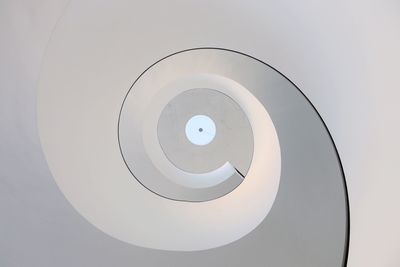Directly below view of spiral staircase in building