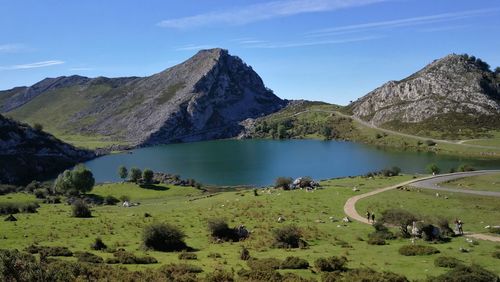 Scenic view of lake and mountains against sky