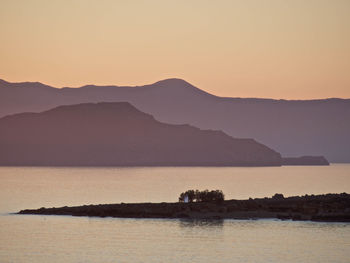 Scenic view of mountains at sunset