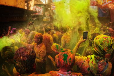 People and colors. people of kolkata are celebrating holi festival on the street of kolkata, india.