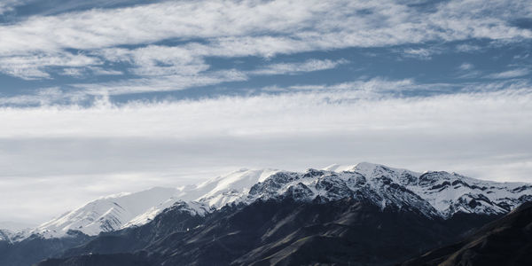 Scenic view of snowcapped mountains against sky